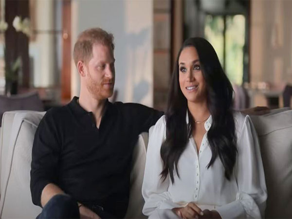 Prince Harry with his wife Meghan Markle