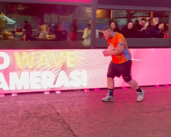 Crowd Erupts In Applause As The Final Runner Crosses The Finish Line At London Marathon